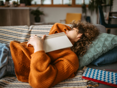 Female fell asleep while reading a book