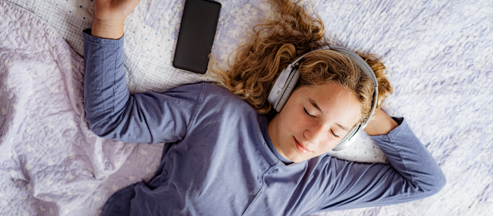 A teenager practices mindfulness to help cope with depression at night.