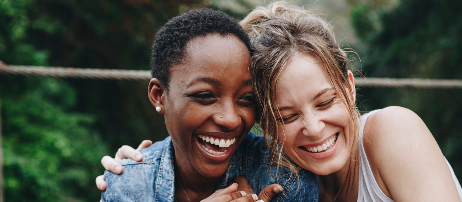 Two young woman celebrating the holidays with each other, their chosen family.