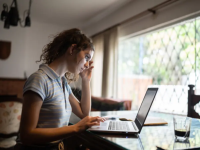 A young woman avoids doing her school homework because she has school anxiety