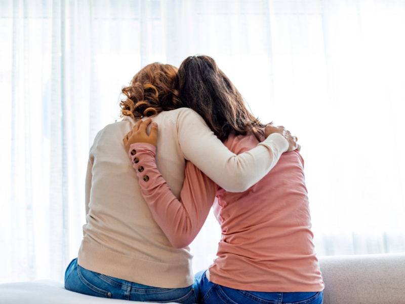 Mom comforting teen daughter