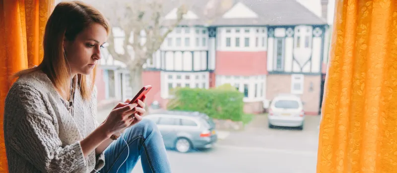 A teenager sits in her room on social media self-diagnosing with mental health conditions seen on social media.