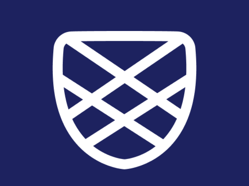 Charlie Health's logo: a white shield on a dark blue background
