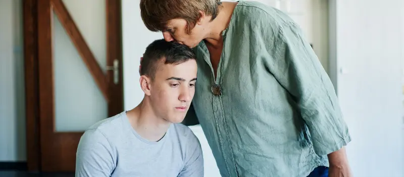 A mother comforts her son who is afraid of growing up and leaving home