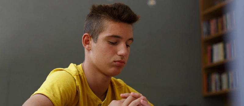A young man dealing with PTSD waits to go to therapy