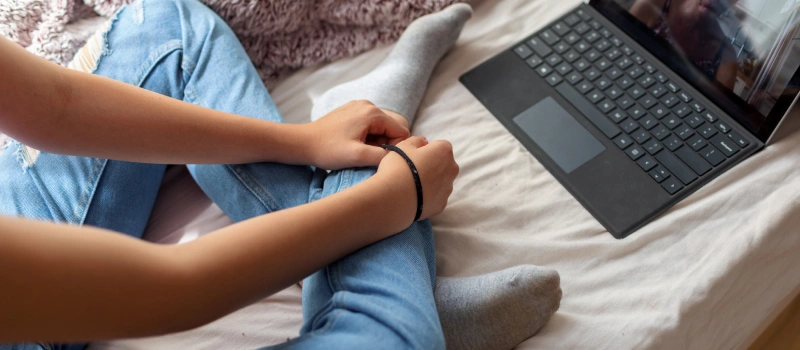 A teen logs into their trauma-focused CBT session online