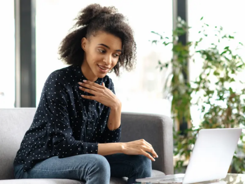 A Black therapist holds a virtual therapy session for BIPOC youth