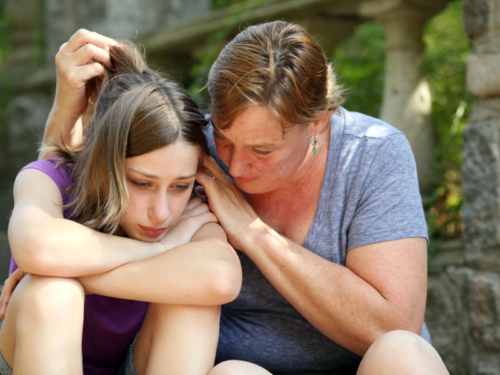 A mom comforts her teen as they both struggle with ancestral trauma