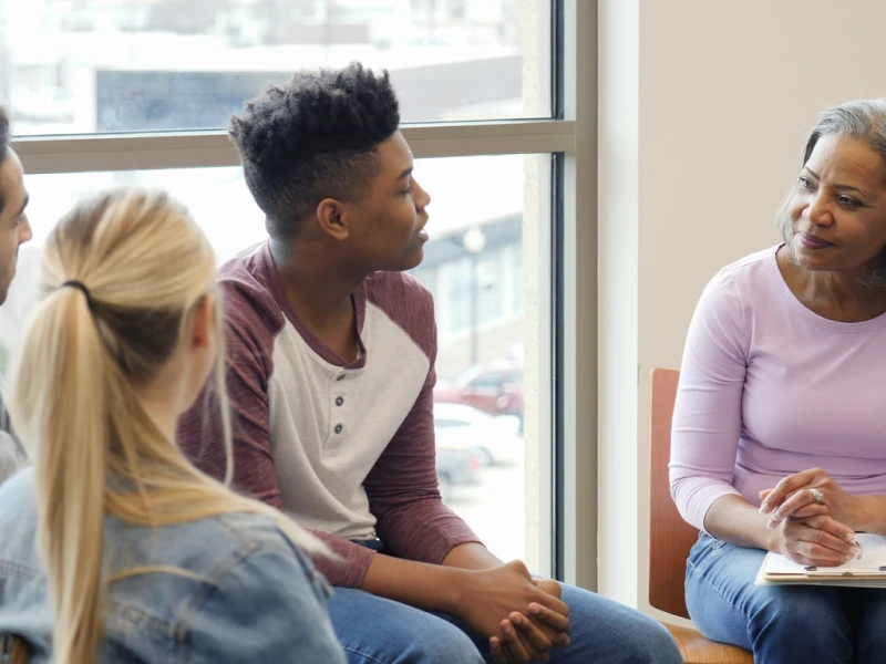 A young man sits in an intensive outpatient treatment program