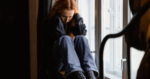 A young woman with red hair struggles with teen dissociative identity disorder