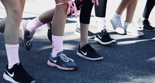 People running in pink clothing to support breast cancer awareness