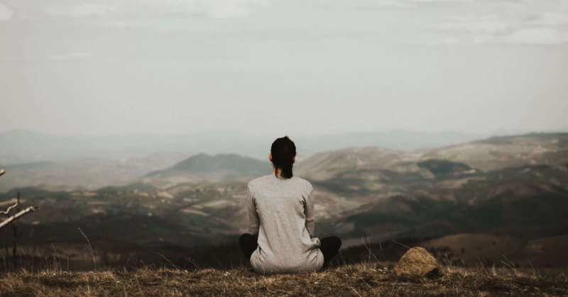 woman sitting practicing self care