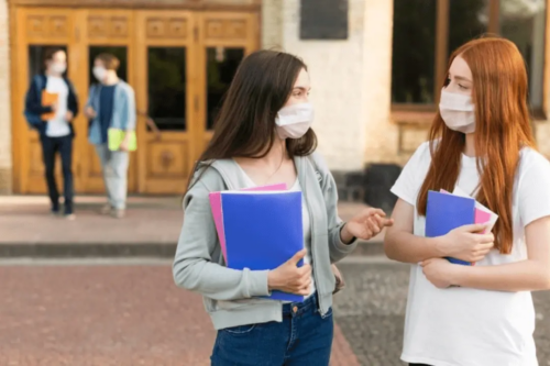 Students wear a mask at the start of a new COVID school year