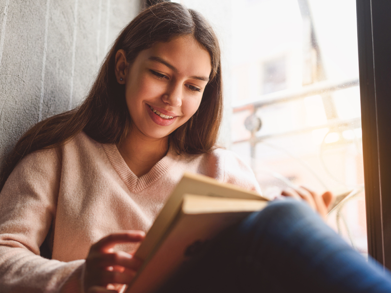 Teen reading while enjoying a self-care day