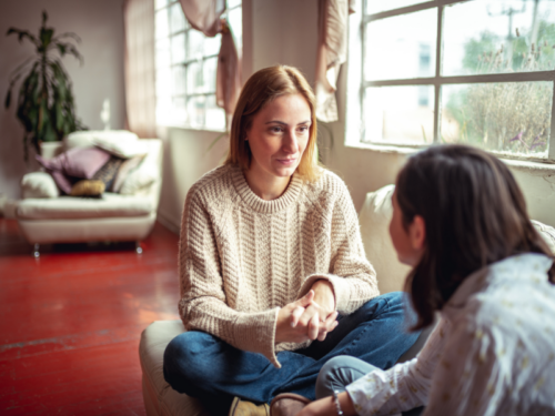 Mother and son talking at home