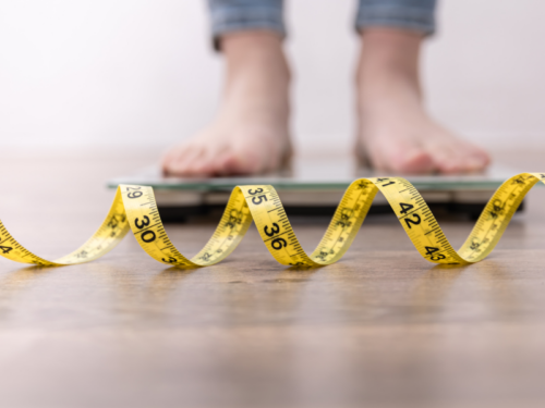 Teen weighing and measuring their body