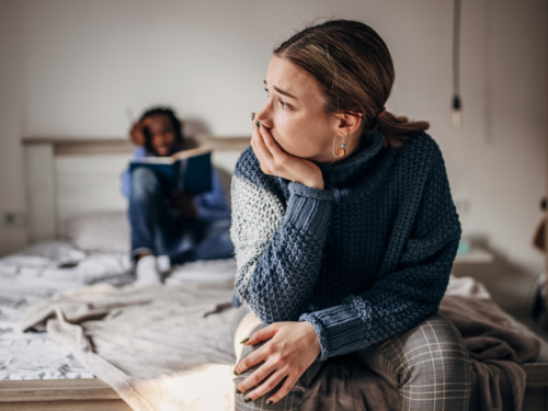 A couple upset in bed at home