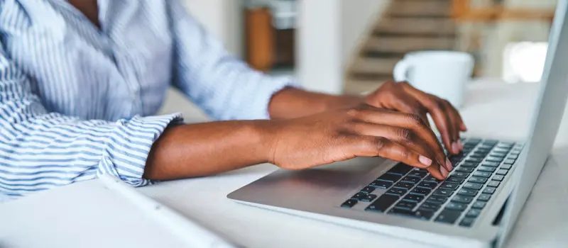 Women typing on a computer