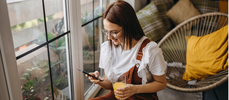 Woman looking at Tiktoks on her phone