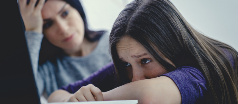 Teenage girl struggling with her schoolwork because of dyslexia