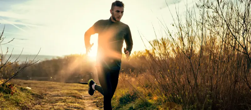 A young man runs intensely to help his mental health 