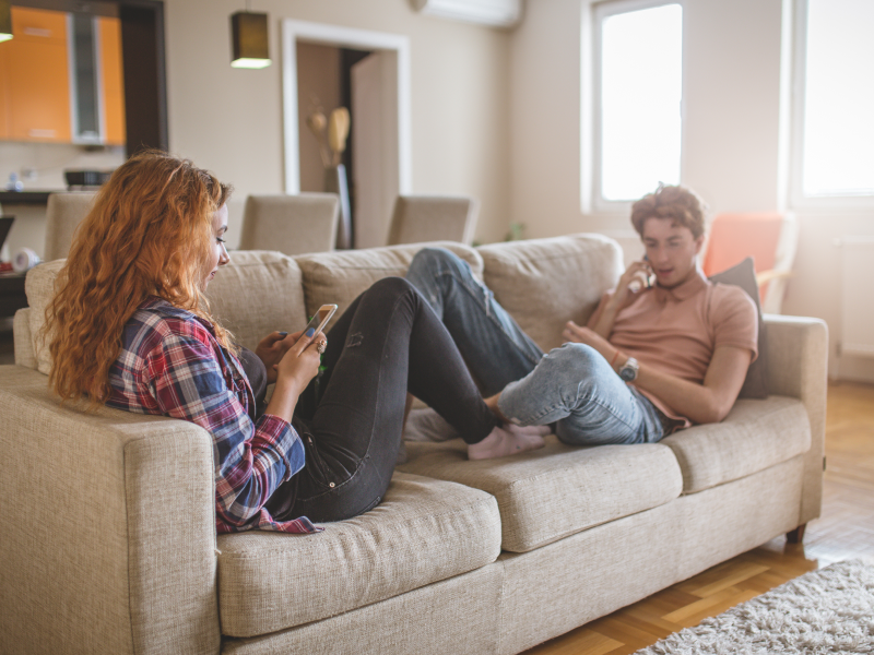 Couple being distracted by their phones