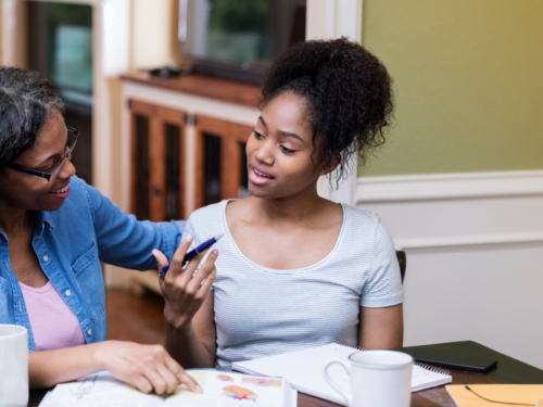 Parent helping their neurodivergent teen with homework