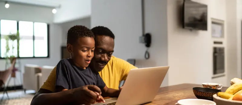 Parent helping his neurodivergent son with homework