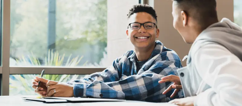 Teen masking his feelings with his friend