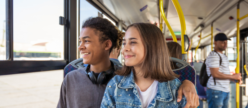 Couple sitting next to each other in a bus