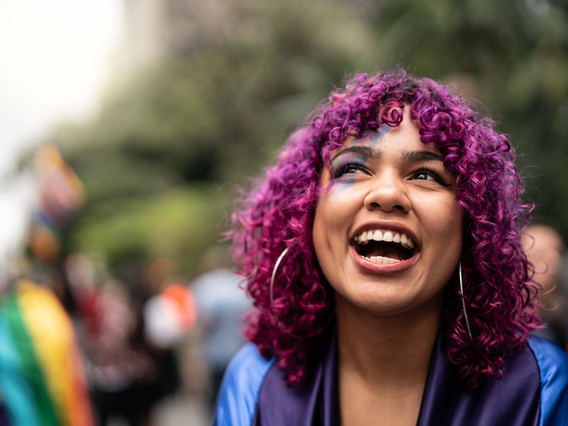 LGBTQIA person smiling at parade