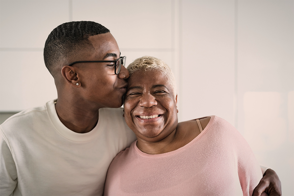 Mother and son embracing