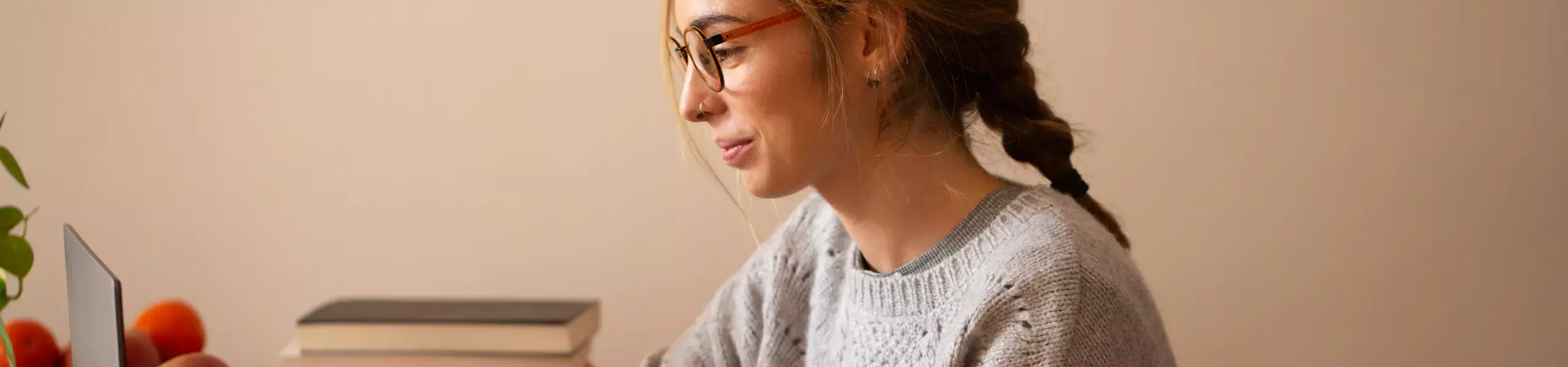 Woman in glasses on laptop