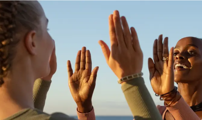 Girl friends high fiving