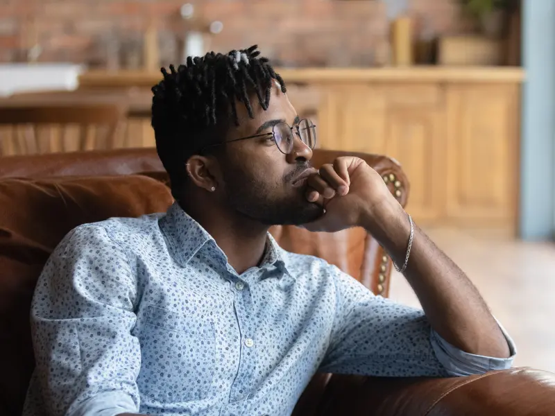 Young man with glasses struggling with a personality disorder