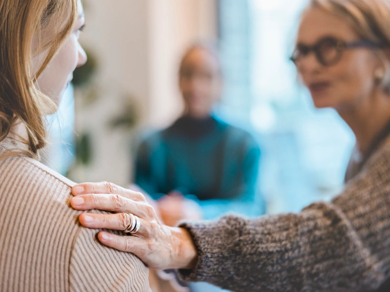 Therapist offering compassion to a client that is dealing with trauma