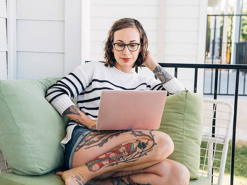 Woman on her laptop participating in CBT with her therapist