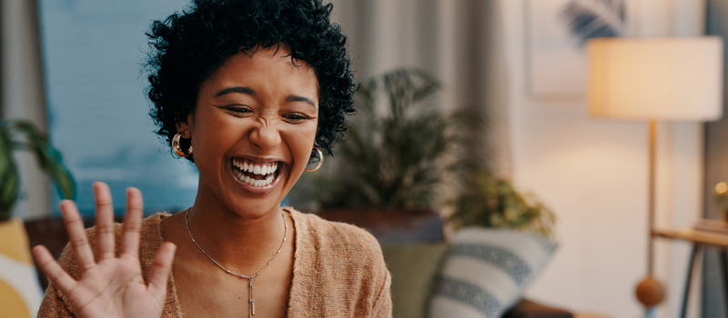 Someone smiles while looking at a screen during an intensive outpatient program for anxiety.