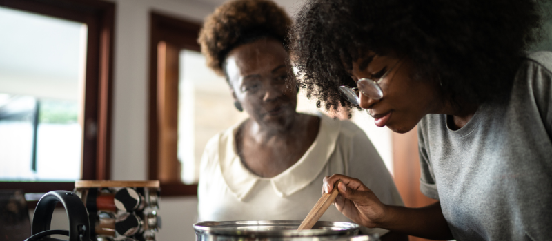 A mom teaches her daughter how to cook—an essential life skill for teens.