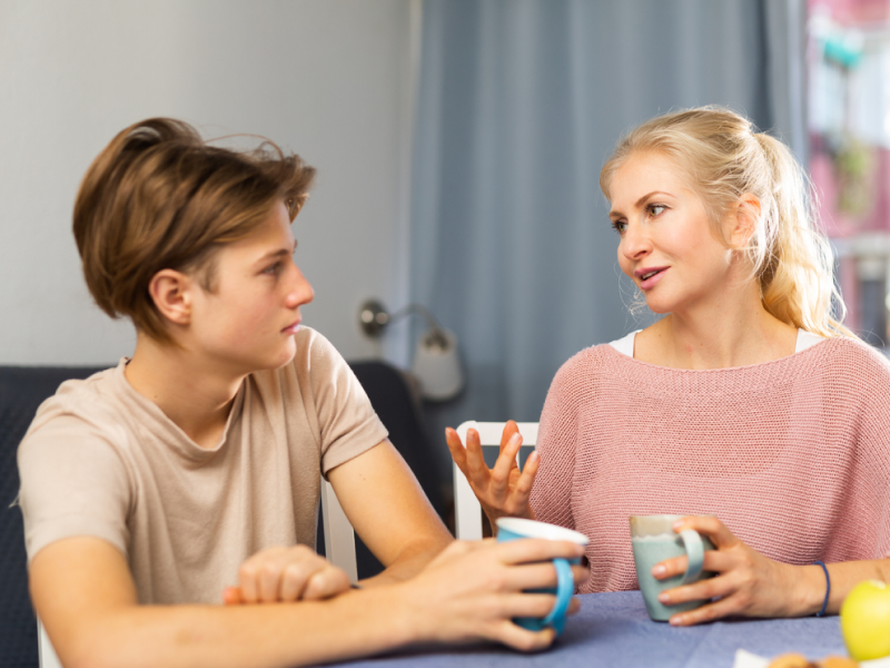 Parent talking to their teen about stress