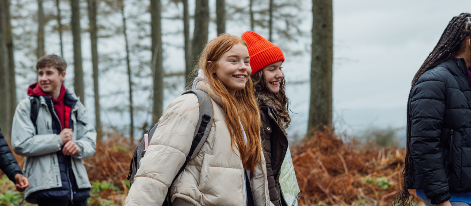A young teen has been managing her hyperfixation and focusing in a healthier way. She is on a hike with friends to stay social and focus on her physical and mental health.