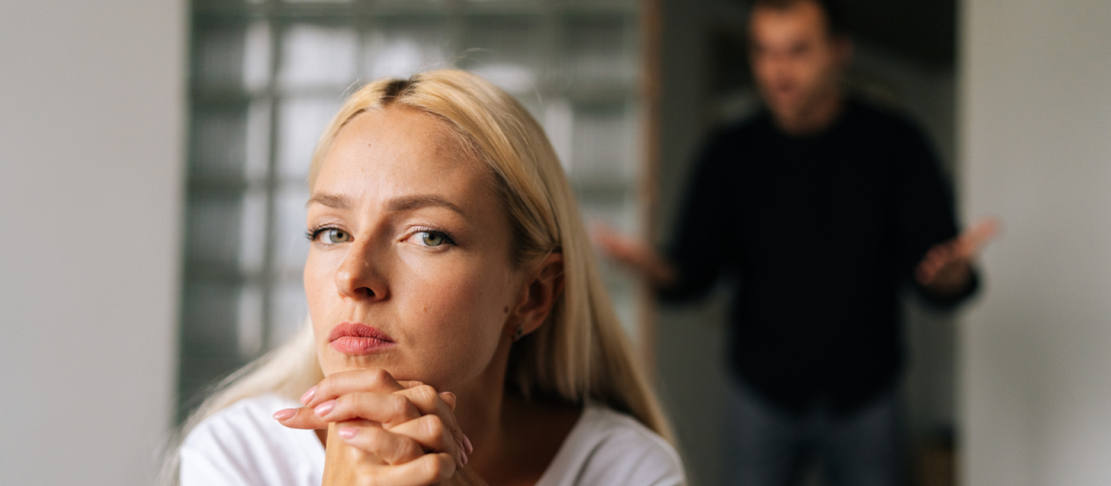 A young woman is getting yelled at by her partner. She has passive-aggressive behavior as a result.