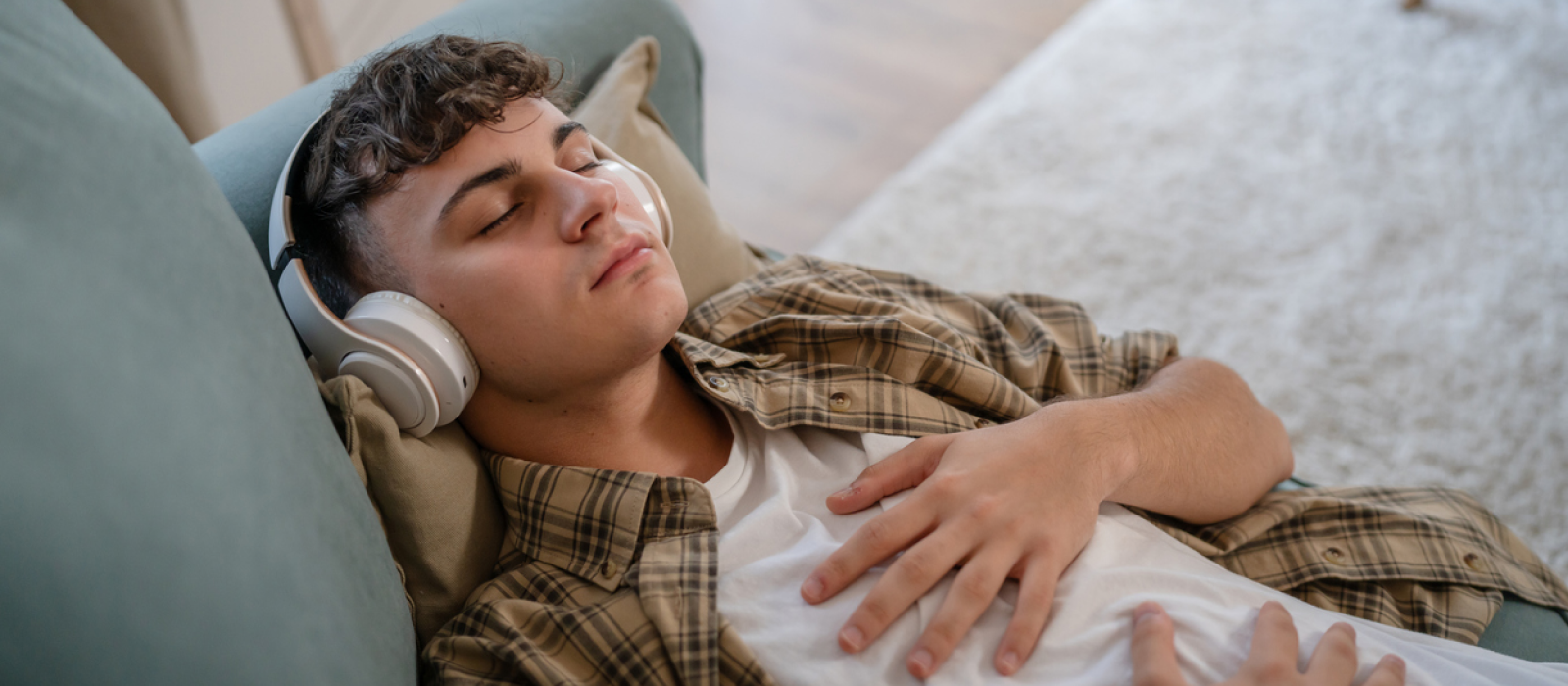 A young man practices mindfulness to cope with existential thoughts and anxiety.