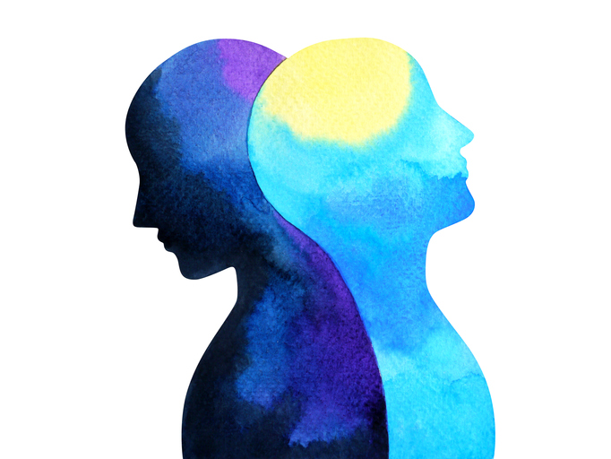 Silhouette of two people blending together