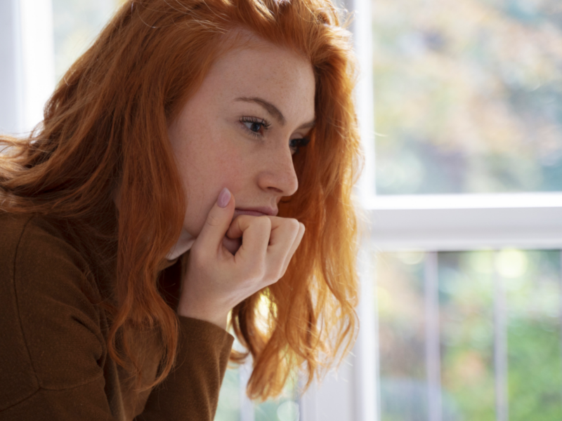 A young woman is experiencing a type of trauma called the mother wound.