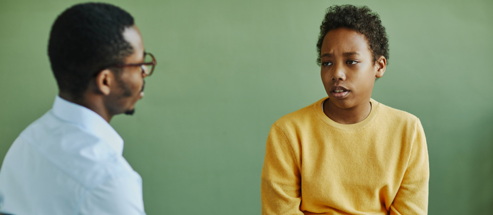 A young man is healing from the mother wound by going to therapy.