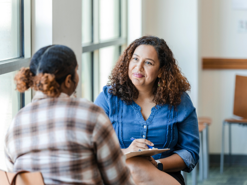 A therapist is explaining the difference between a therapist and a psychiatrist to a client.