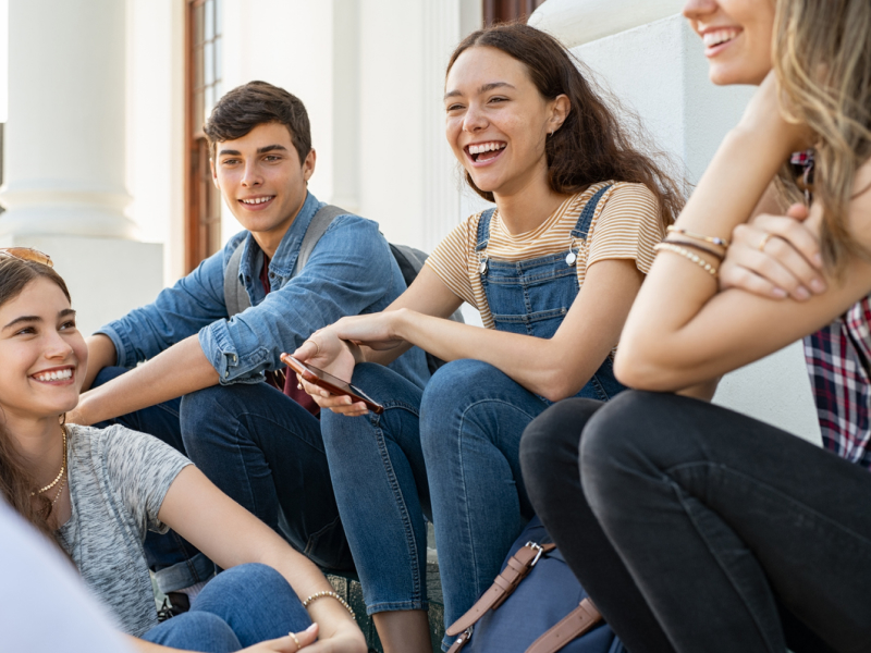 A group of young people smile after an exposure therapy for anxiety session.