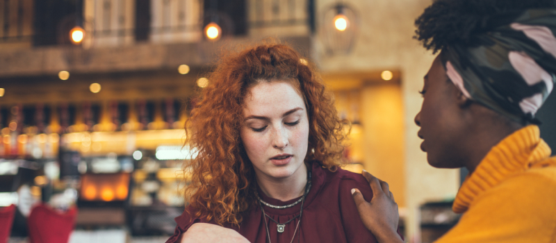 Two friends are at a coffee shop seeking closure from their friendship breakup.