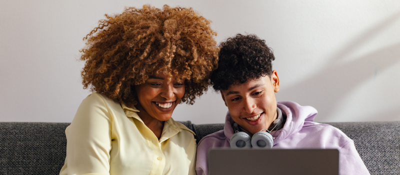 A mother and son research IOP services at Charlie Health.